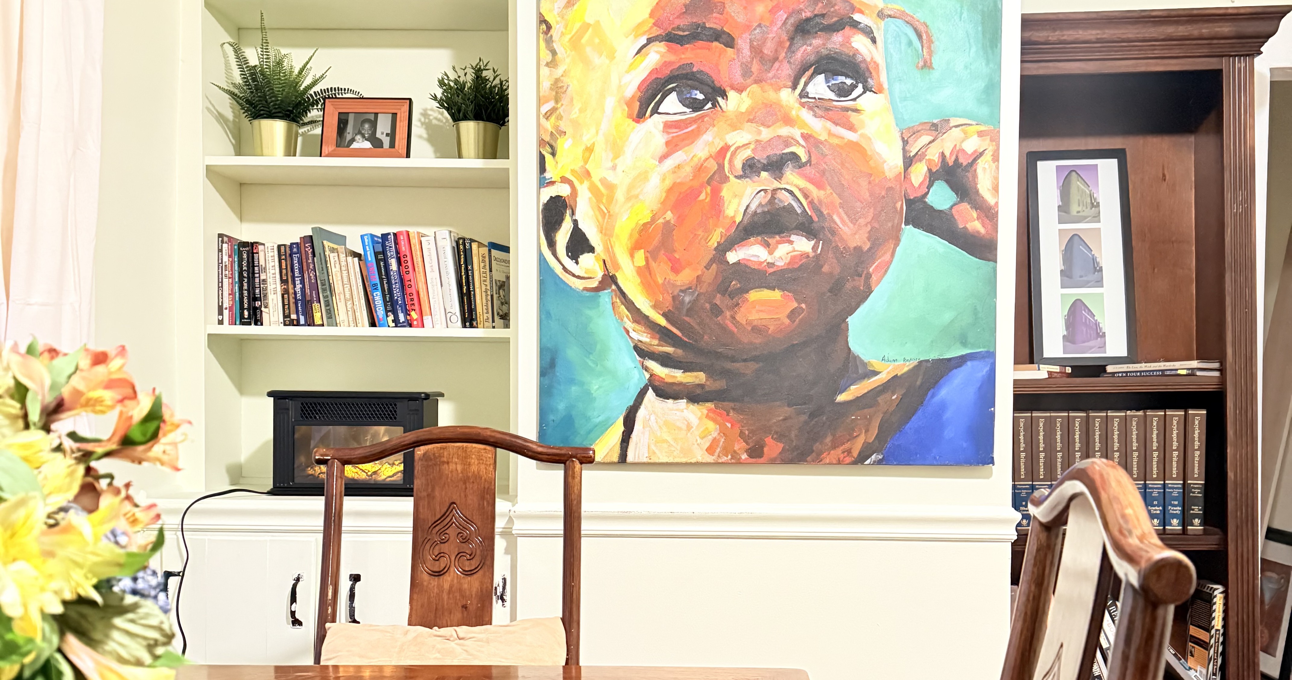 Long table at 817 N Howard Street beneath the child portrait