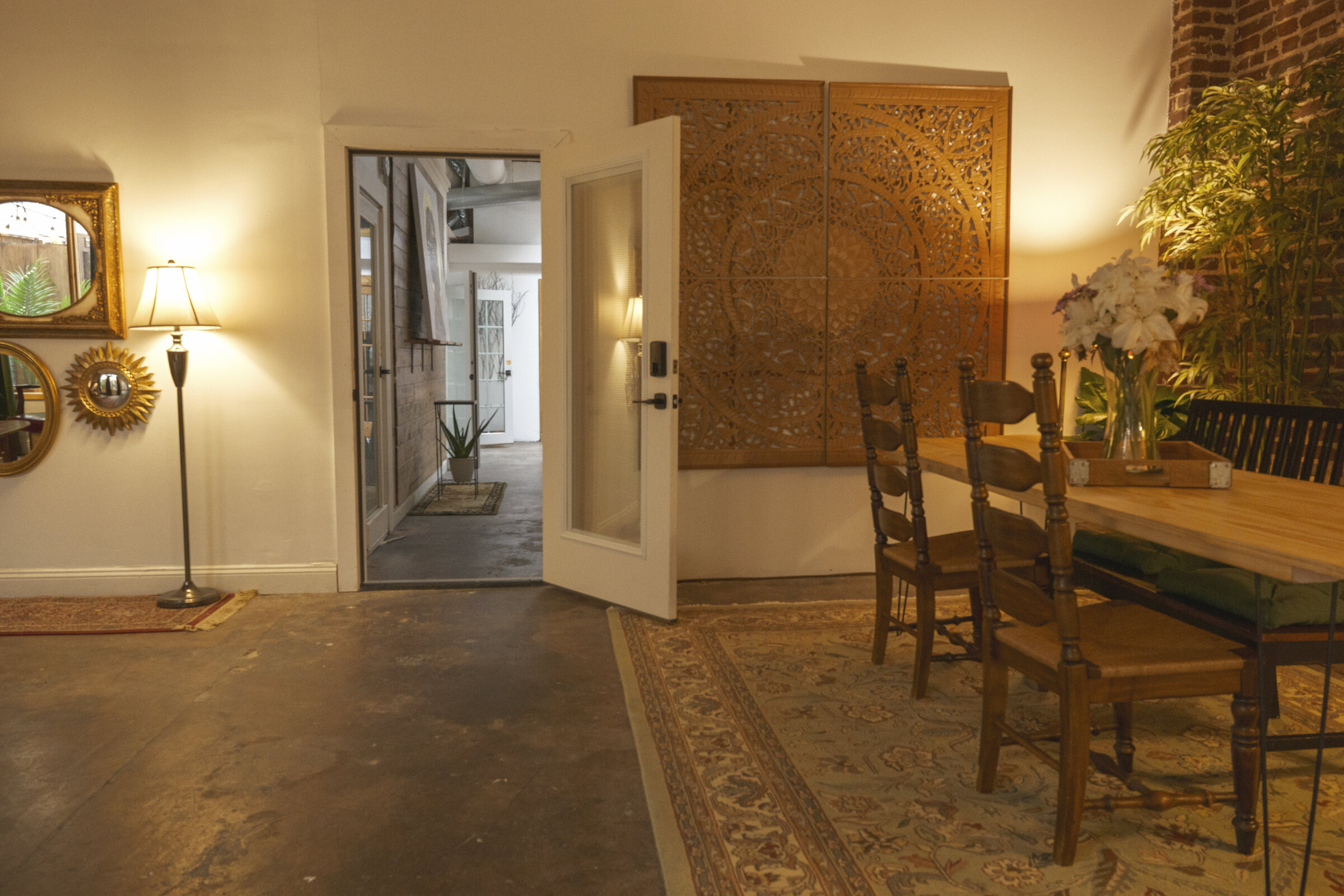 Long room with archway and dining table